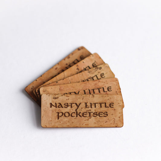 Nasty Little Pocketses Cork Tag